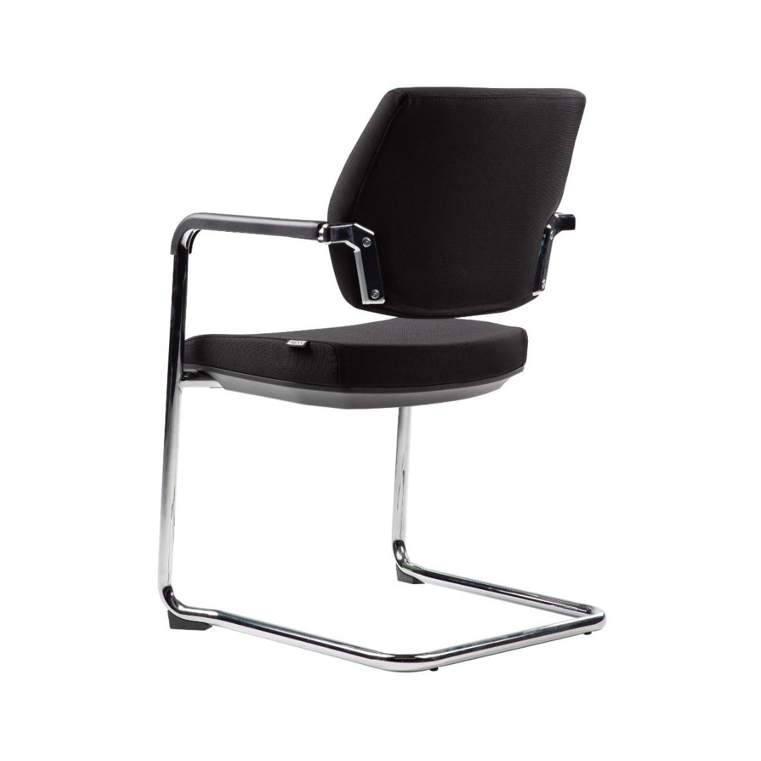 The image shows a conference chair, characterized by its sleek design and minimalist aesthetic. It features a black fabric seat and backrest with a chrome frame, providing a modern look suitable for office or conference settings. The chair has armrests for added comfort, making it ideal for meetings or collaborative environments.