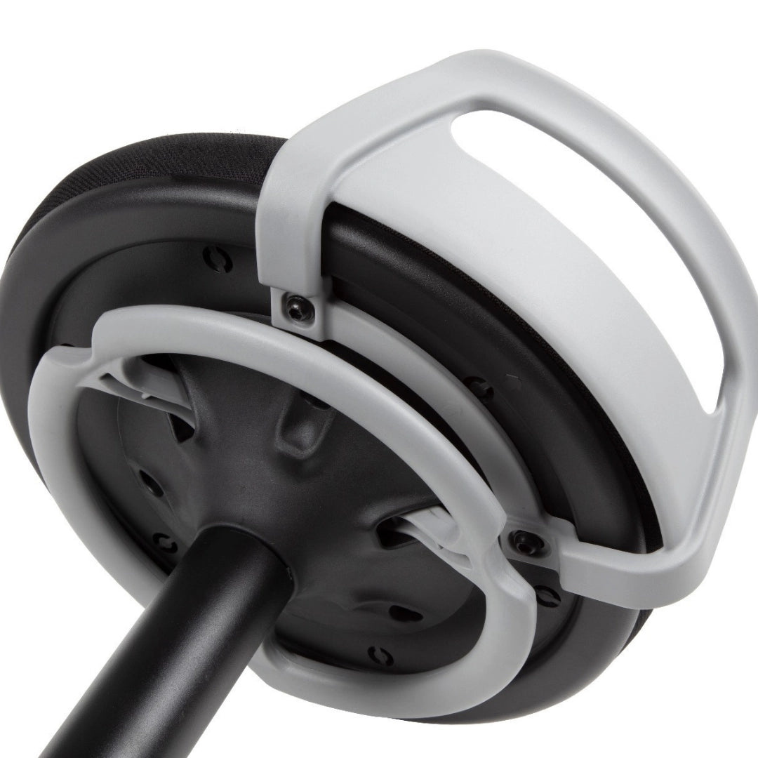 The product depicted is a sit-stand stool designed for ergonomic use, promoting active sitting and balance. The image shows the underside of the stool, highlighting a sturdy base with a handle for easy maneuverability. The design emphasizes functionality and comfort, suitable for modern office environments.