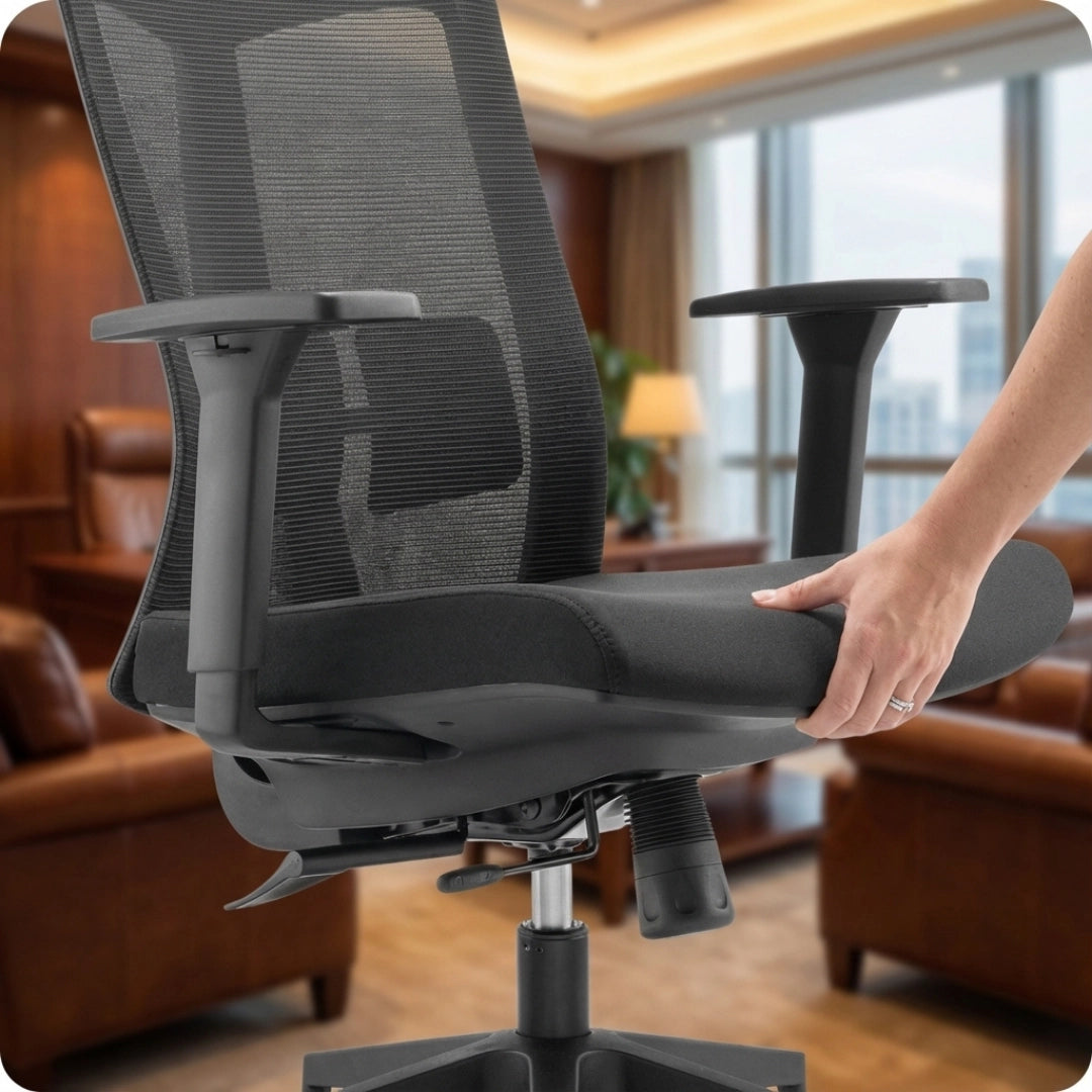 The image features an ergonomic office chair, specifically the UVI Energetic model. It showcases a sleek design with a mesh backrest and a cushioned seat. A hand is seen adjusting the armrest, highlighting the chair's adjustable features, set in a well-furnished office environment.