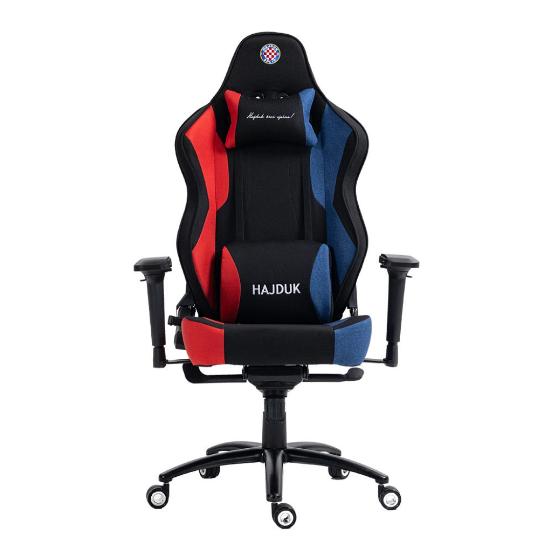 The product is an ergonomic gaming chair, specifically the UVI X Hajduk model. The chair features a sporty design with a combination of red and blue fabric, providing both comfort and style. It includes adjustable armrests and a supportive headrest, making it suitable for long gaming sessions.