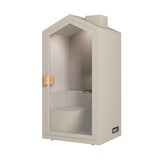 The product is an acoustic meeting pod designed for private conversations or focused work. It features a cottage-like design with a light, neutral color scheme and a glass door. Inside, there is a comfortable seating area and a small wooden shelf, creating a cozy and functional space for meetings or calls.