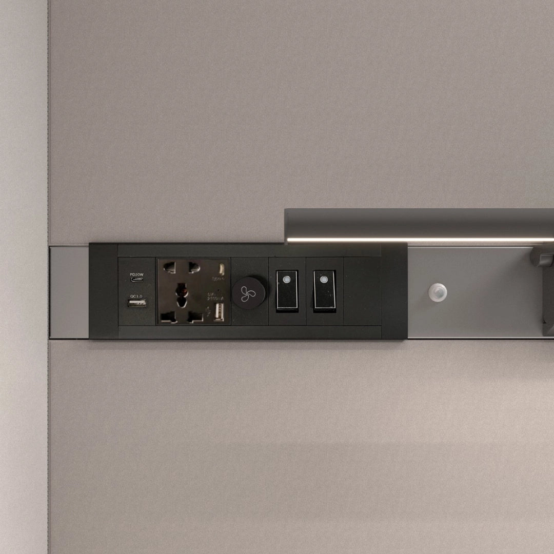 The product is a power and control module designed for acoustic meeting pods. It features multiple power outlets, USB ports, and switches for lighting and ventilation. The sleek design integrates seamlessly into the pod's interior, enhancing functionality and convenience for users.