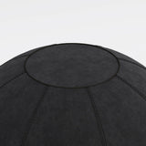 The product is an ergonomic seating ball, designed to promote better posture and comfort while sitting. It features a textured black surface with visible stitching, indicating durability and style. The image shows a close-up view of the top of the ball, highlighting its round shape and design details.