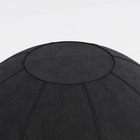 The product is an ergonomic seating ball, designed to promote better posture and comfort while sitting. It features a textured black surface with visible stitching, indicating durability and style. The image shows a close-up view of the top of the ball, highlighting its round shape and design details.