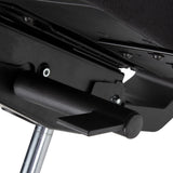 The image depicts an ergonomic office chair, specifically highlighting a part of its mechanism. It features a black frame with a visible lever and adjustment components, suggesting functionality for seat height or tilt adjustments. The design emphasizes comfort and support, typical of ergonomic chairs.