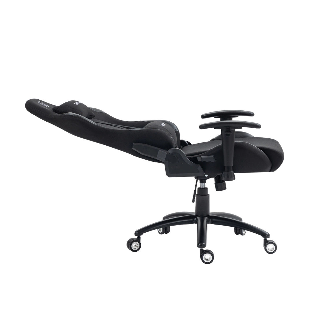 The product is an ergonomic office chair designed for gaming, specifically the UVI model in black. The image shows the chair reclined, featuring a sleek design with plush cushioning and adjustable armrests, all mounted on a five-point base with wheels for mobility.