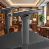 The product is an ergonomic office chair, specifically the UVI Focus model. The image shows a close-up of the chair's armrests and seat, highlighting their sleek design and sturdy construction. The background features a well-furnished office space, suggesting a professional setting.