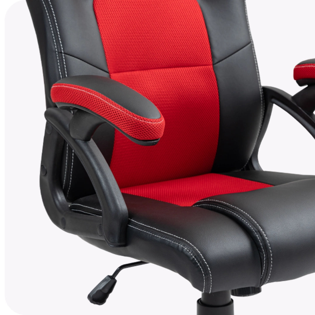 The product is an ergonomic office chair designed for gaming, specifically the UVI Hero model in red. The image shows a close-up of the chair's seat and armrests, featuring a combination of black synthetic leather and red mesh fabric, with visible stitching details and an adjustable lever for height adjustment.