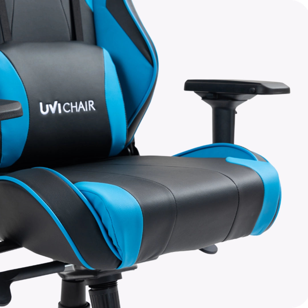 The product is an ergonomic gaming chair from the brand UVI CHAIR, model UVI SPORT XL in blue. The image showcases the chair's cushioned seat and backrest, featuring a sleek design with a combination of black and blue colors, along with adjustable armrests for added comfort.