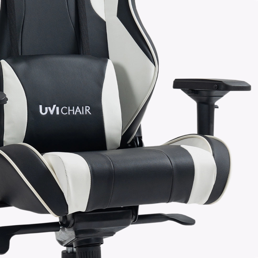 The image features an ergonomic gaming chair from the brand UVI, specifically the UVI Chair model. The chair is designed with a sleek black and white color scheme, showcasing padded armrests and a supportive backrest, emphasizing comfort for long gaming sessions.