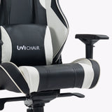 The image features an ergonomic gaming chair from the brand UVI, specifically the UVI Chair model. The chair is designed with a sleek black and white color scheme, showcasing padded armrests and a supportive backrest, emphasizing comfort for long gaming sessions.