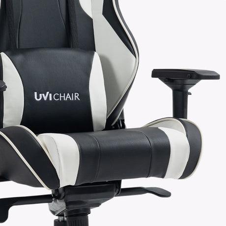 The image features an ergonomic gaming chair from the brand UVI, specifically the UVI Chair model. The chair is designed with a sleek black and white color scheme, showcasing padded armrests and a supportive backrest, emphasizing comfort for long gaming sessions.